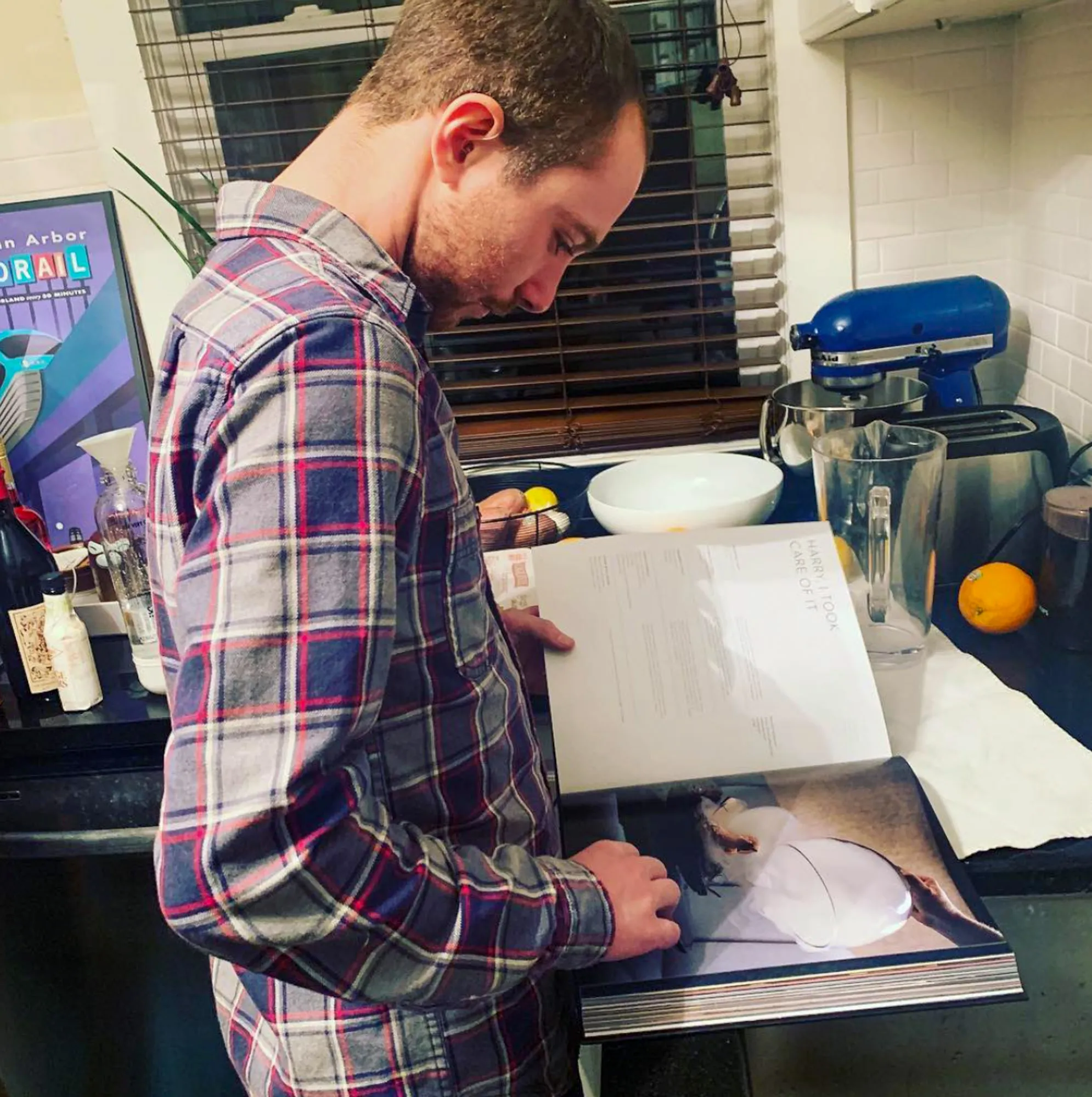 Alex leafing through one of the other 117 recipes in the book.