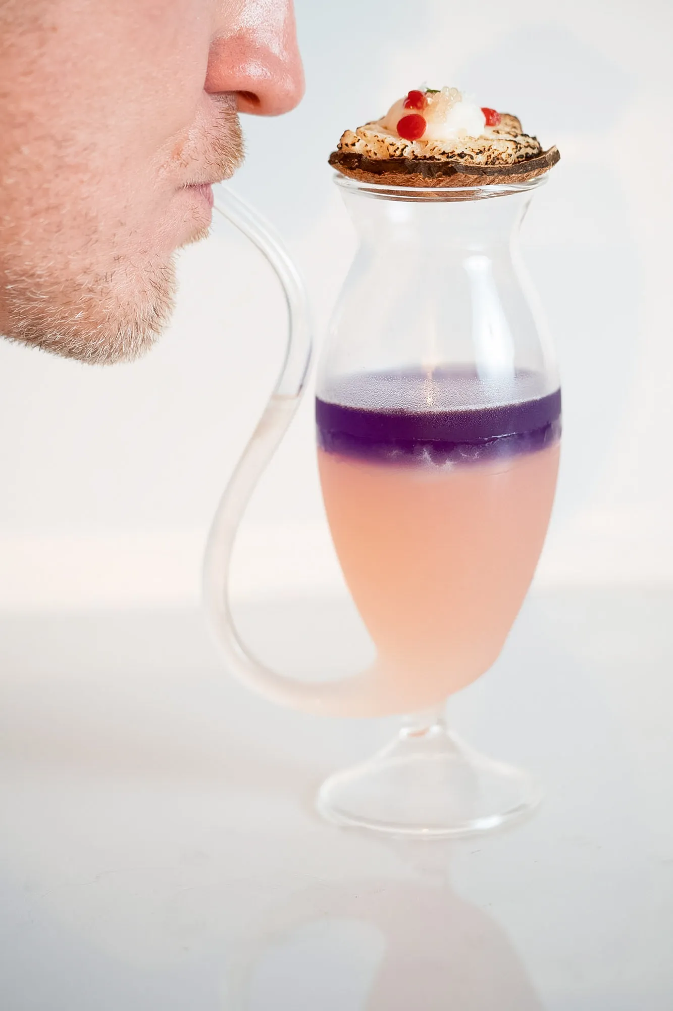 Mid-blow into the port pipe, colors just starting to swirl together